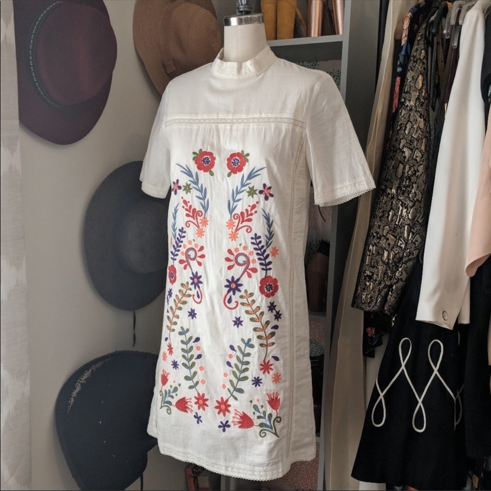 White mini dress with colorful embroidery